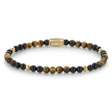Edelstenen bead armband, handgemaakt van 4mm Tijgeroog en Onyx stenen, en met vergulde edelstalen beads. De sluiting is gemaakt van verguld edelstaal. Het Rebel & Rose sieraad is makkelijk te combineren met andere zilveren, leren of kralenarmbanden.

Modelnaam	Mix Tiger Black - 4mm 
Modelnr.	RR-40133-G-S
Collectie	Bracelets Beads
Type sieraad	Armband
Kleur	Goud, Bruin, Zwart
Sluiting	Stainless Steel
Materiaal	Edelstenen
Steensoort	Tijgeroog, Onyx, 
Afwerking	Polish
Breedte (mm)	4mm
Garantie	6 maanden
